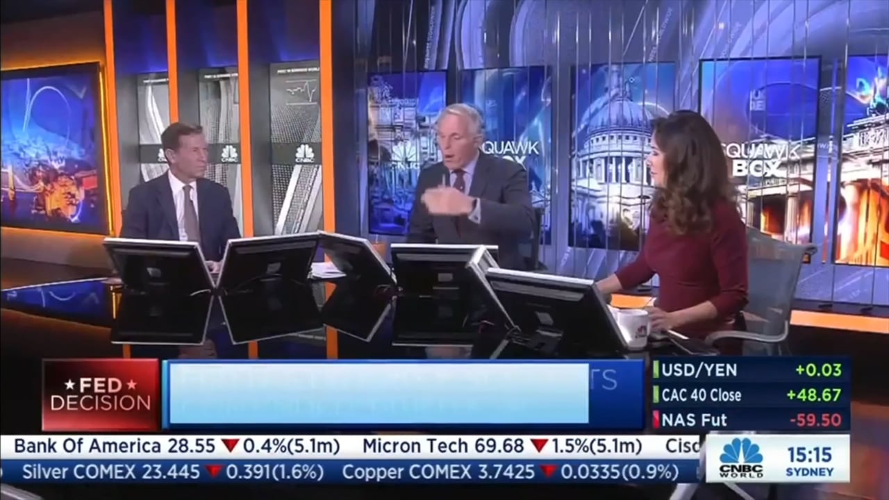 Neal Wilson, seated at left, appearing with presenters in the CNBC Europe studio
