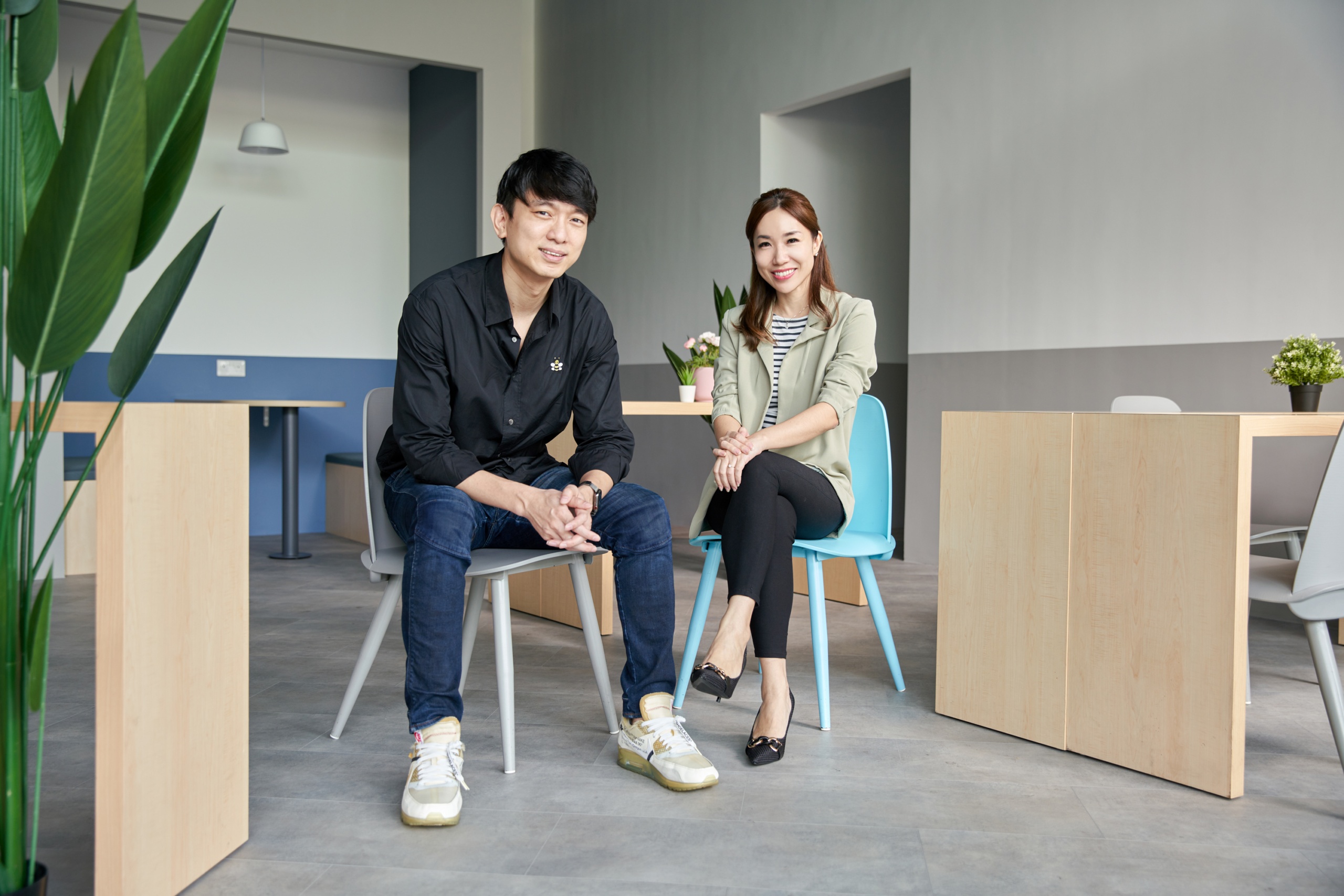 Geniebook co-founders Neo Zhizhong, left, and Alicia Cheong seated in a classroom