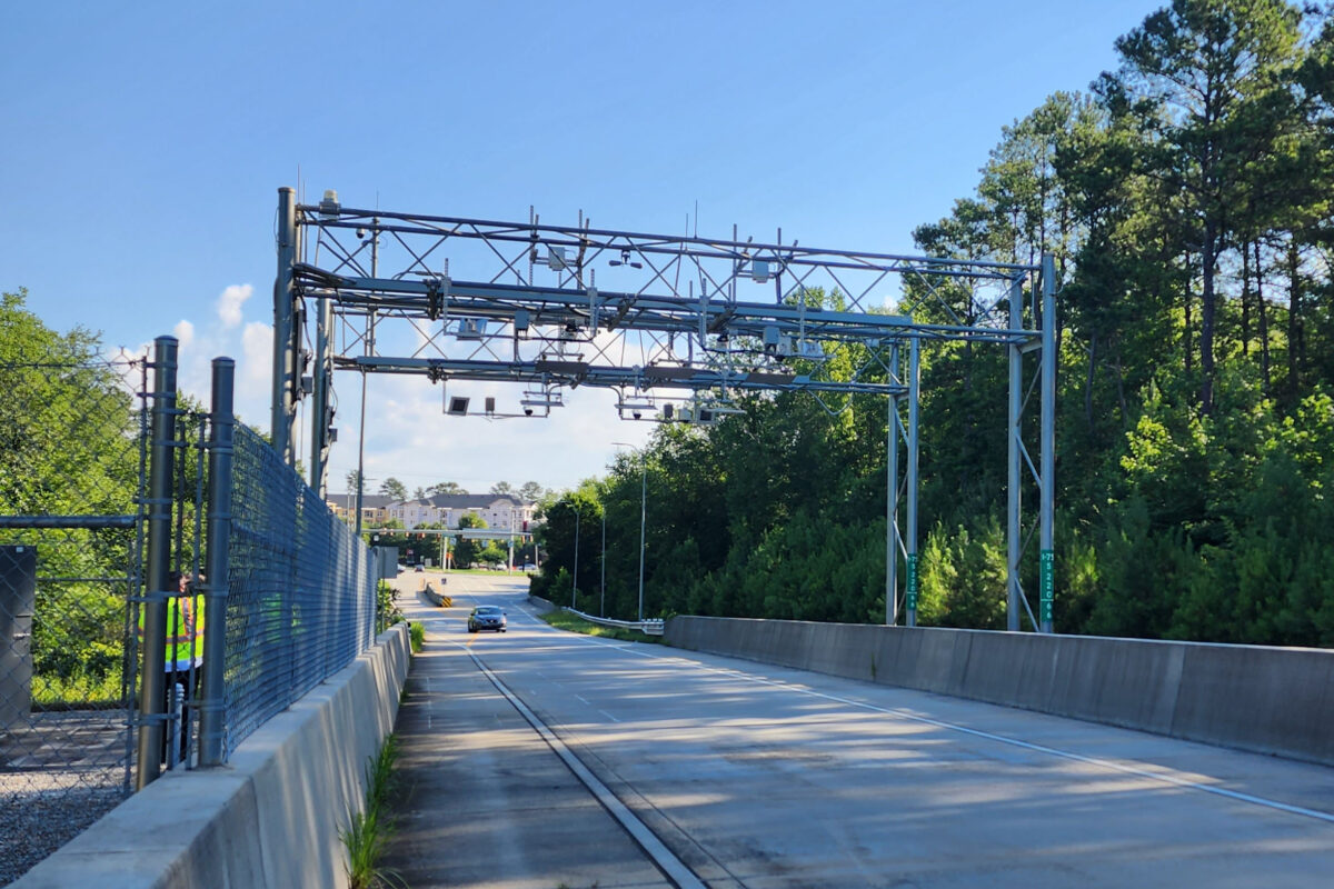Roadside tolling gantry equipped with cameras and identification equipment, pictured by Neology