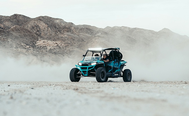 Polaris all-terrain vehicle in a desert landscape
