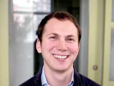 Fundera co-founder Jared Hecht smiling in an office