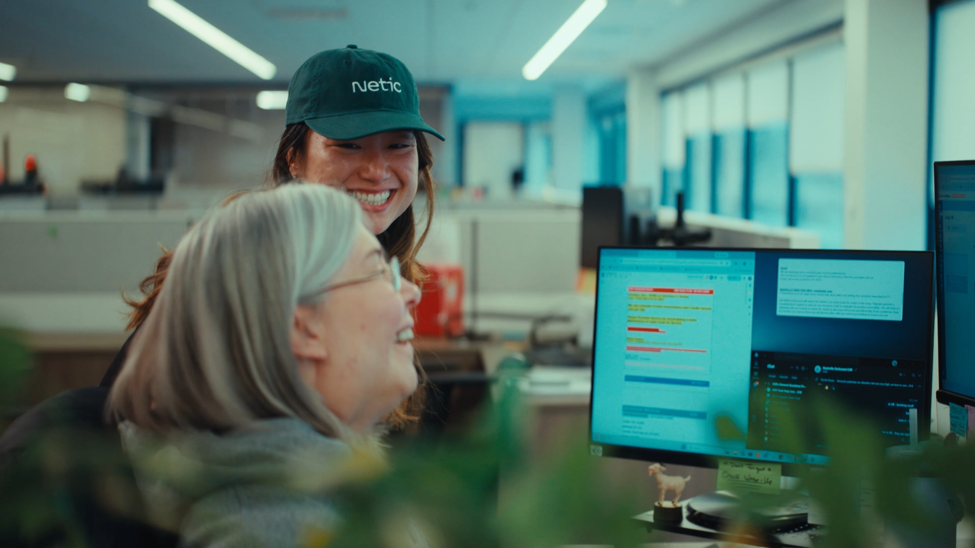 A Netic team member working alongside a Hoffmann Brothers employee in an office