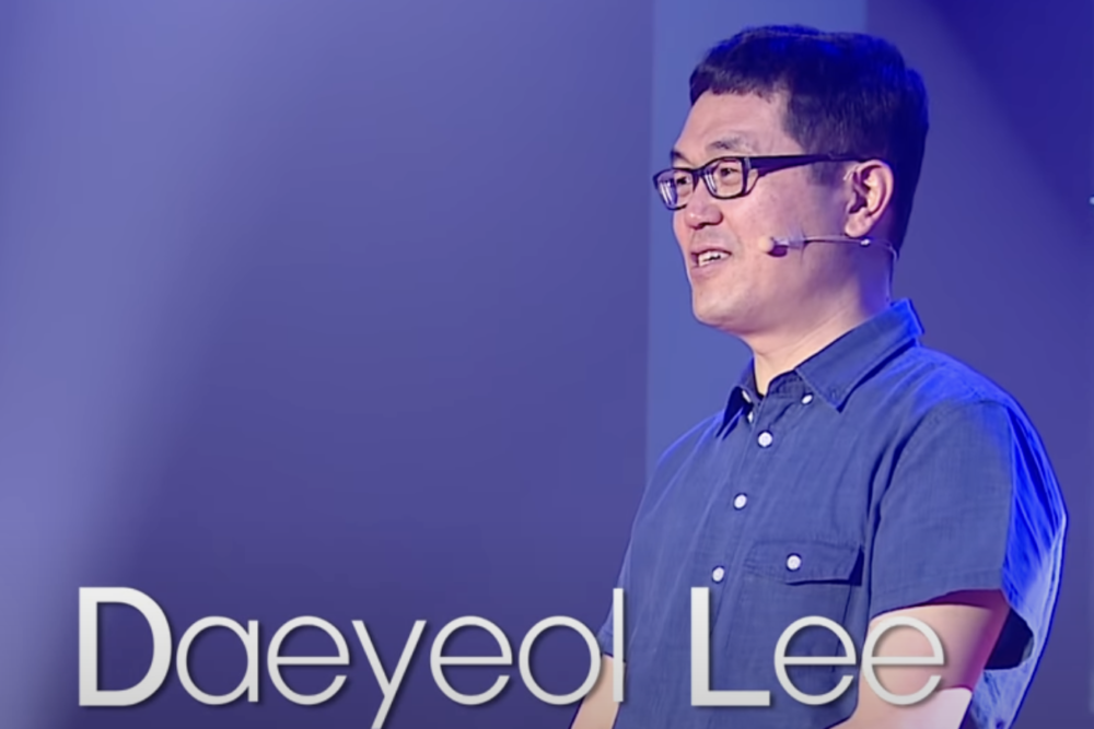 Co-founder Daeyeol Lee speaking on stage