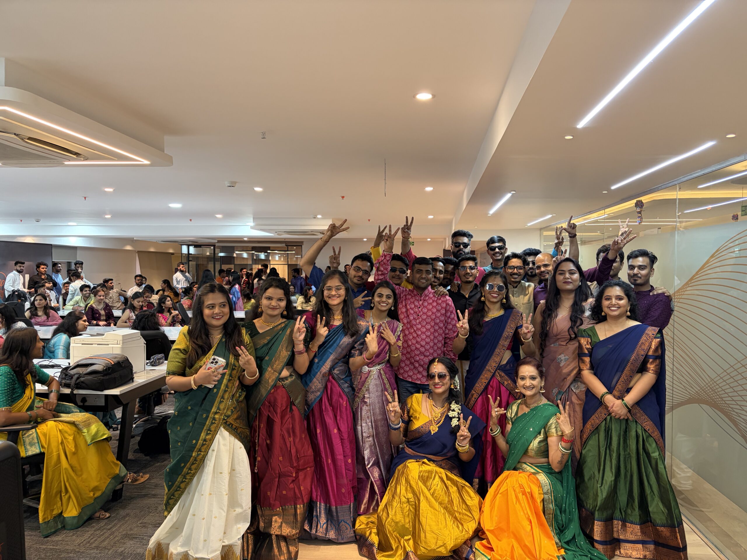 Neutrino colleagues gathering in traditional attire at a company cultural day