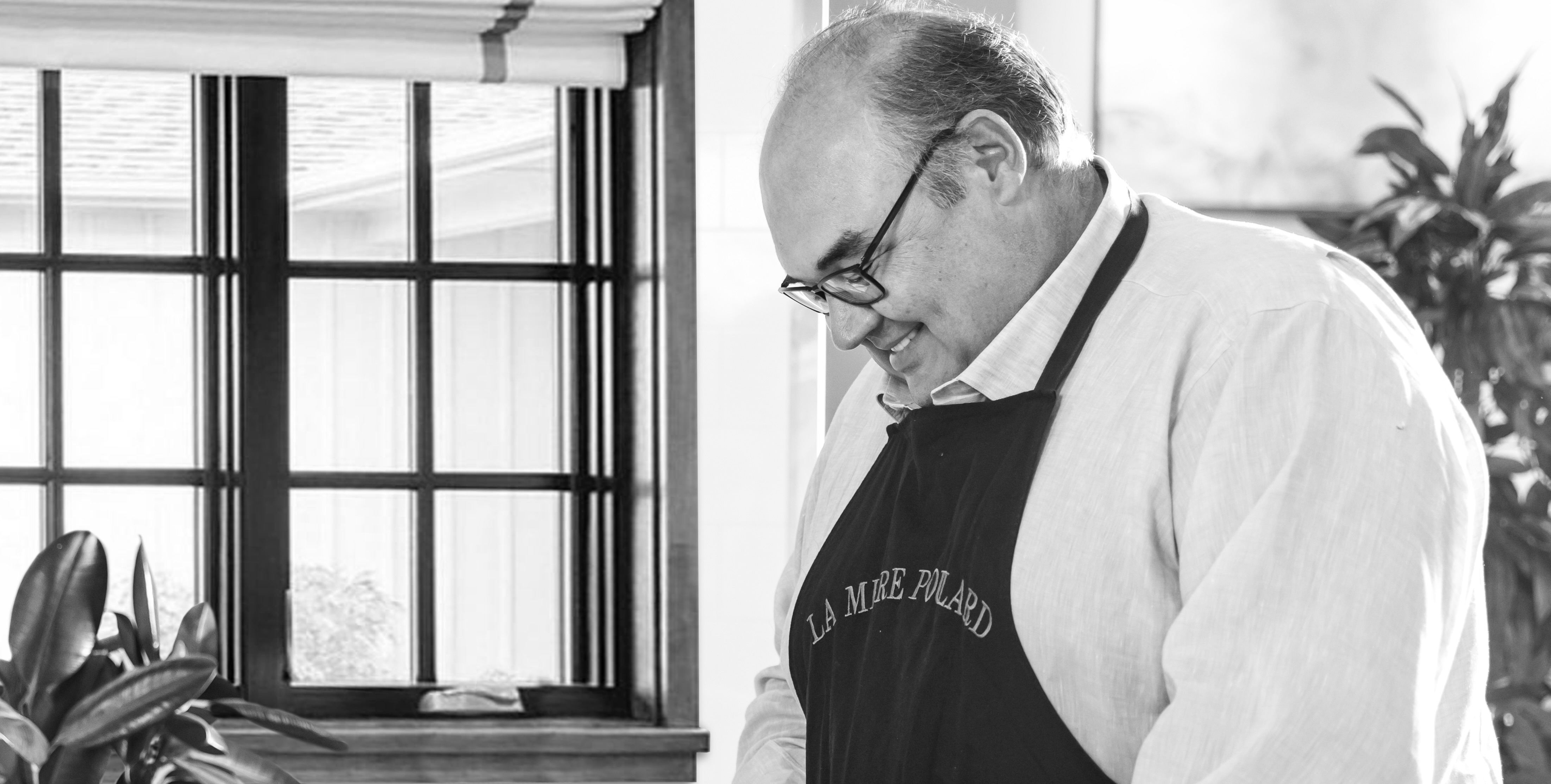 Newk's co-founder Chris Newcomb wearing an apron