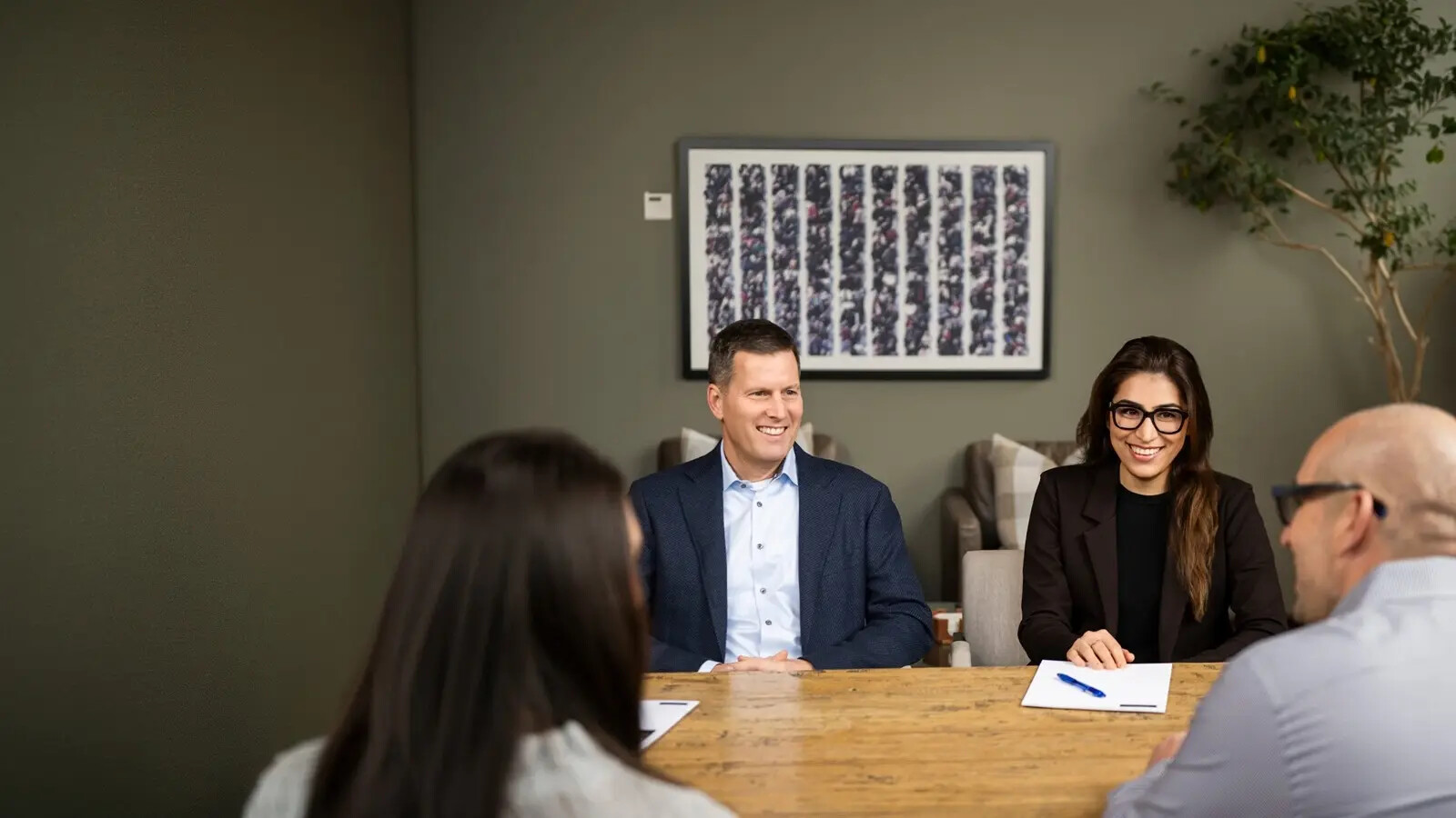 Members of the Newport Private Wealth team in a bright office setting