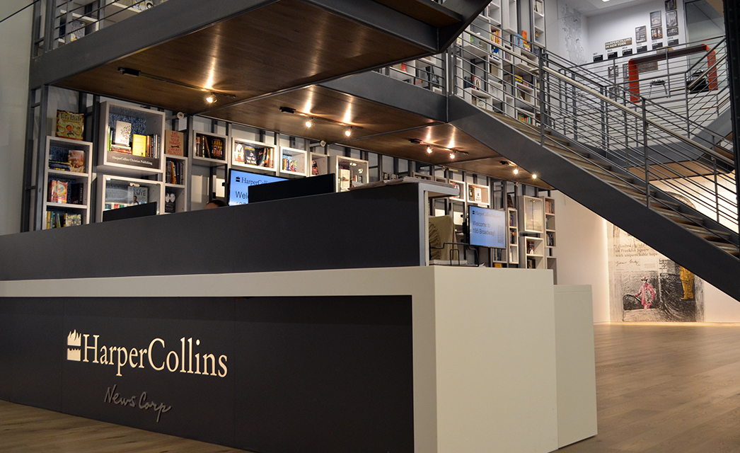 HarperCollins office reception, with bookshelves and an open staircase