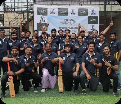 NewVision colleagues posing with cricket bats at their Premier League 2026 event