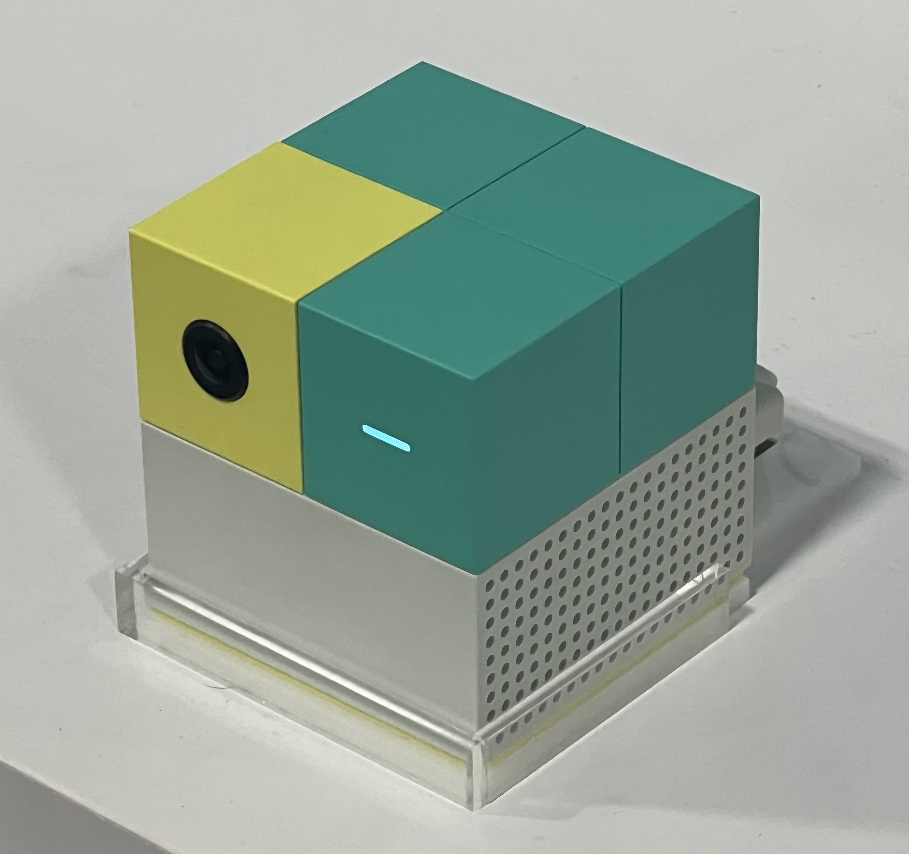 The Nex Playground console - a small white cube with an ultra-wide camera.