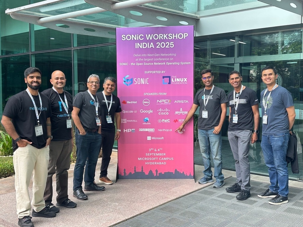 Seven Nexthop team members beside the SONiC Workshop India 2025 sign in Hyderabad