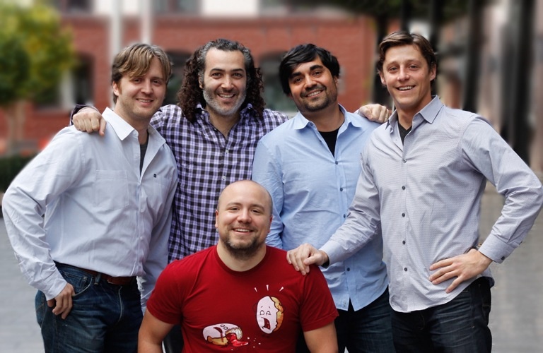 Five members of the AdRoll executive team posing together in 2013