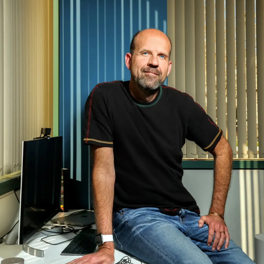NextSense founder Jonathan Berent seated at a desk