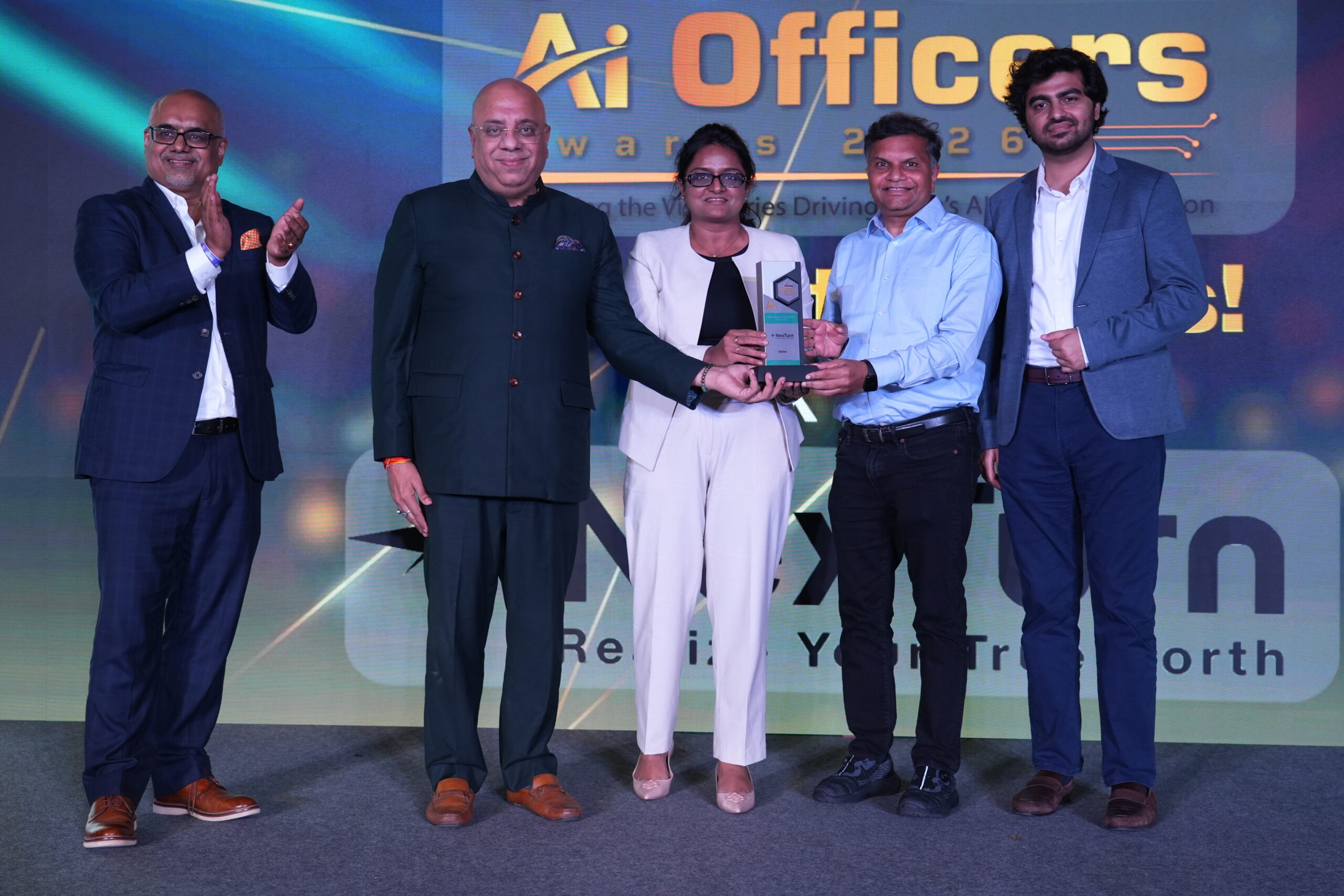 NexTurn team members receiving the AI/ML-Driven Data Solution of the Year award in Bengaluru