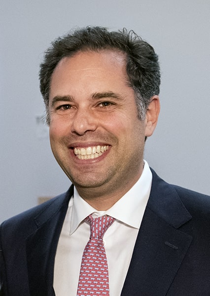 Niche founder and CEO Luke Skurman in a suit and patterned tie