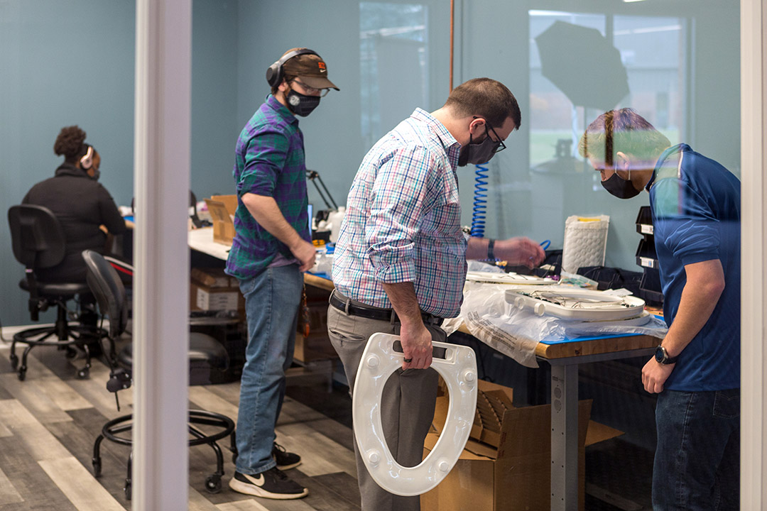 Nicholas Conn and colleagues working on toilet-seat prototypes at Casana