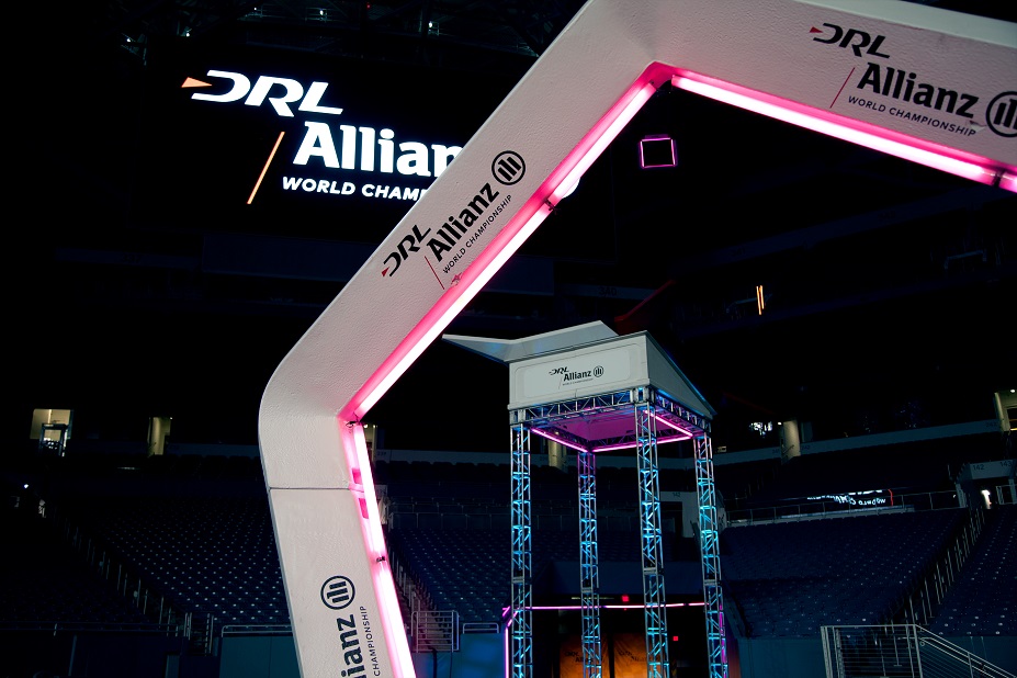 Illuminated DRL Allianz racing gates rise through an indoor arena