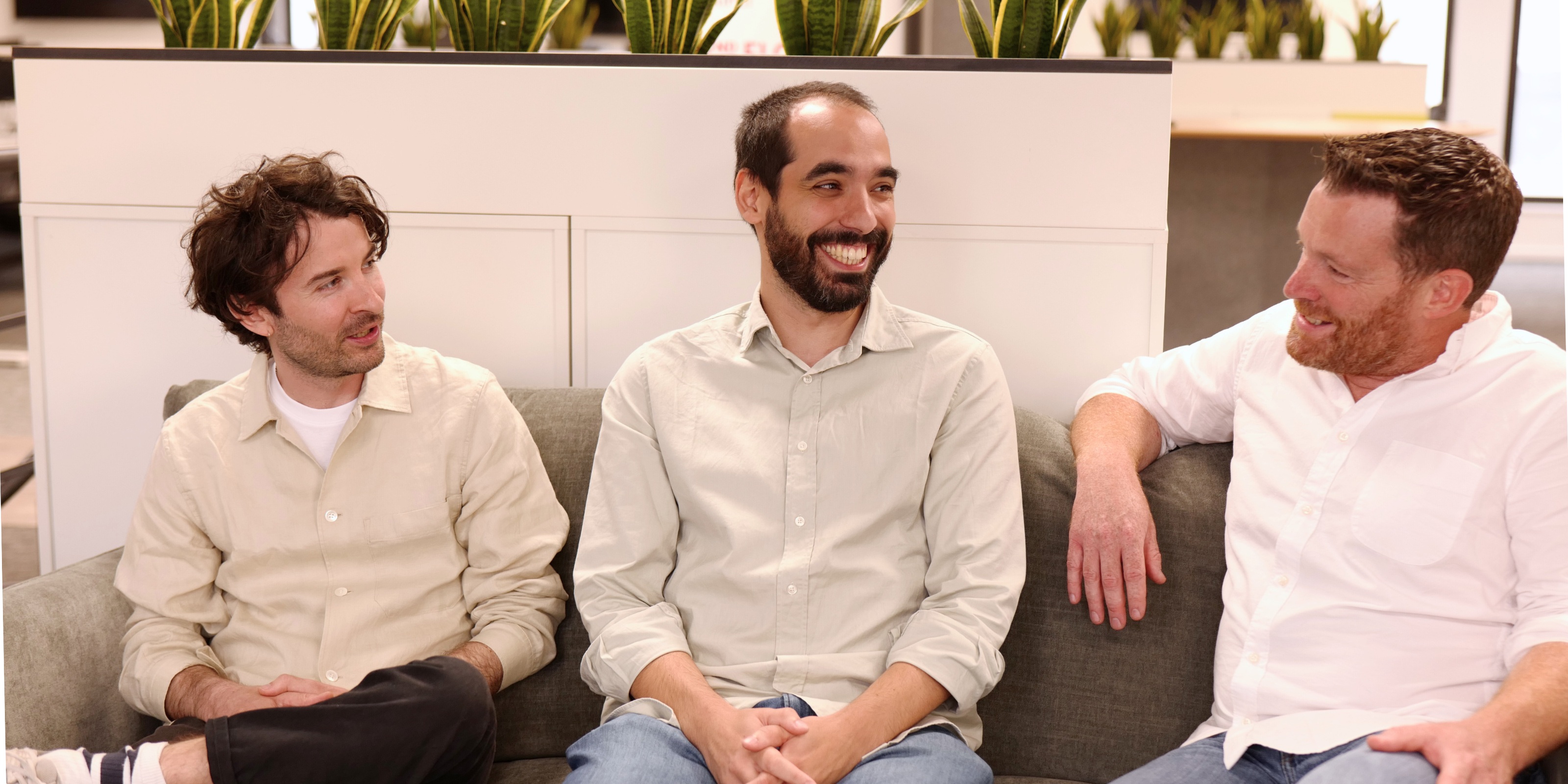 Pierre Cuquemelle and Filipe Pereira of Airport AI sitting with Nicholas Key, at right, on a sofa