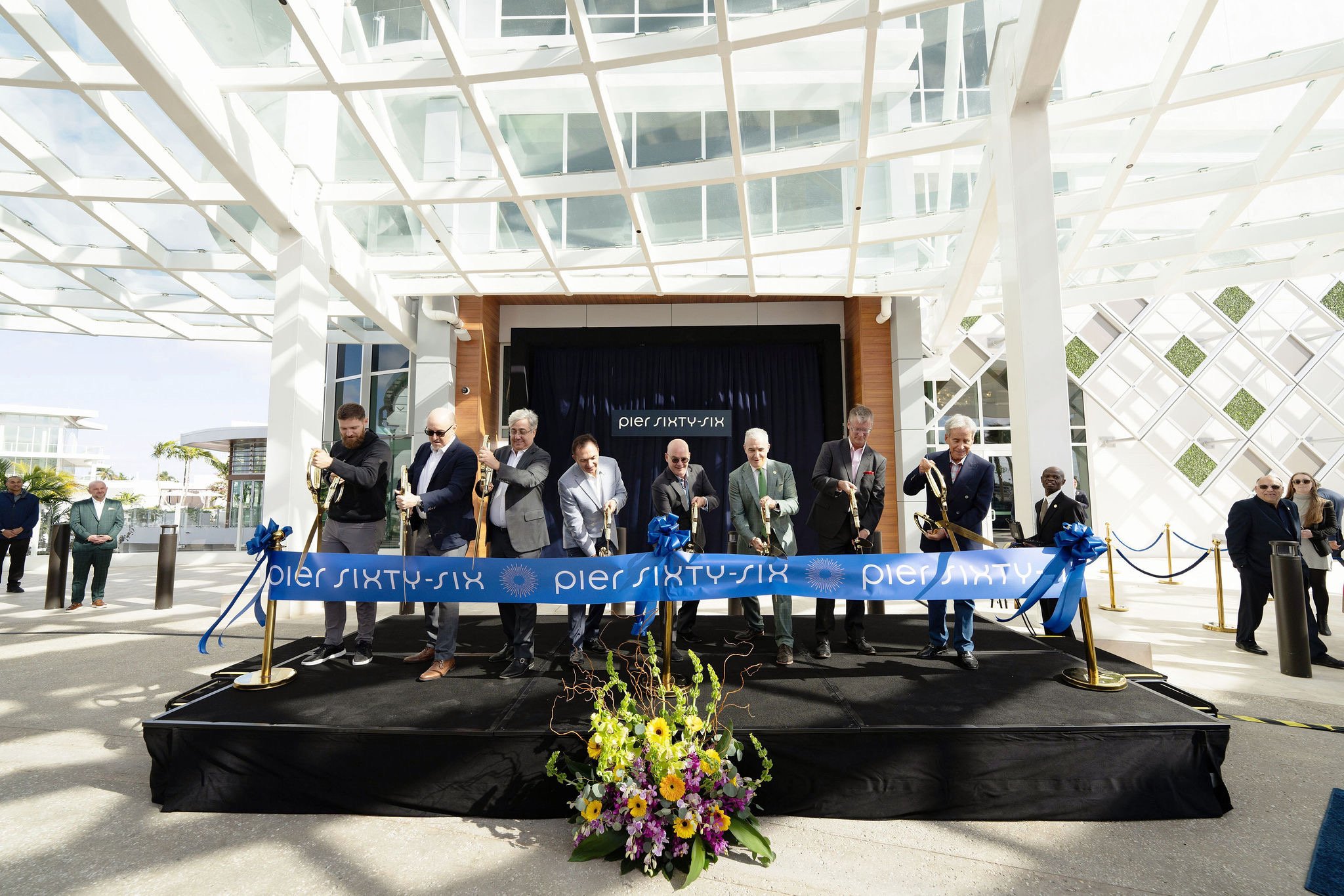 Nick Beucher at the left of the central ribbon-cutting line at Pier Sixty-Six, with Tavistock colleagues and Fort Lauderdale officials