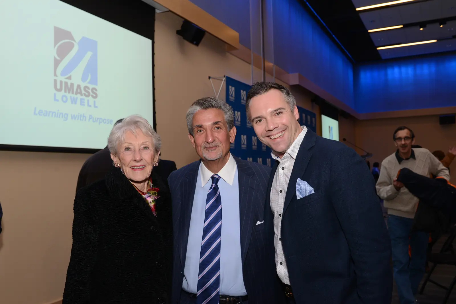 Nancy Donahue with film co-producers Ted Leonsis and Nick Buzzell at UMass Lowell