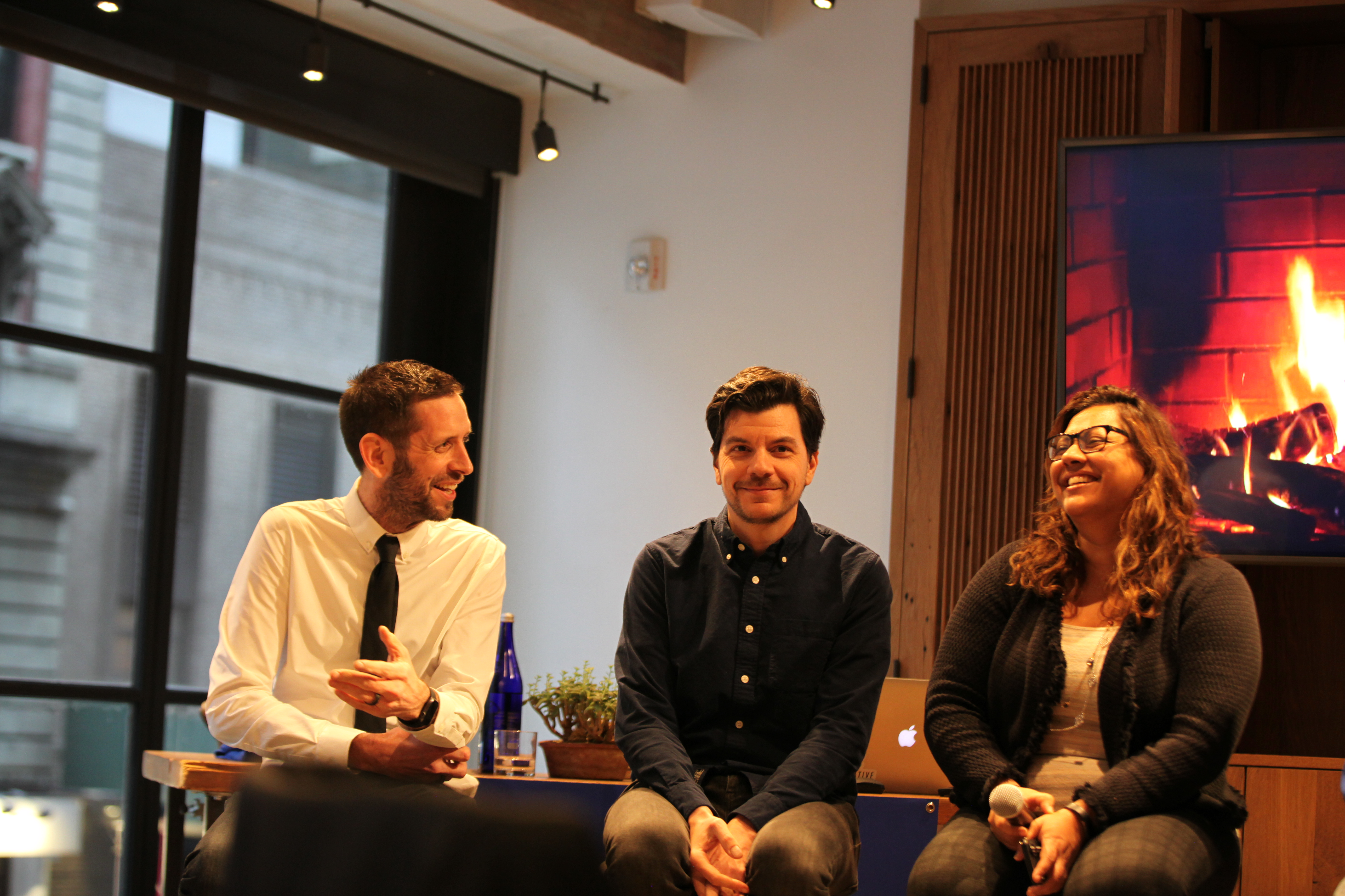 Nick Jordan, at left, laughing with two Narrative team members
