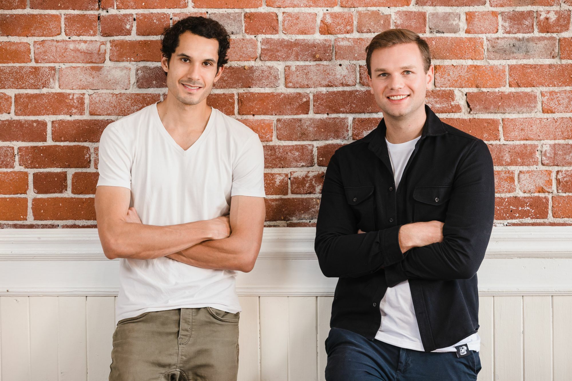 Courtyard co-founders Paulin Andurand, left, and Nicolas le Jeune, right, standing against a brick wall