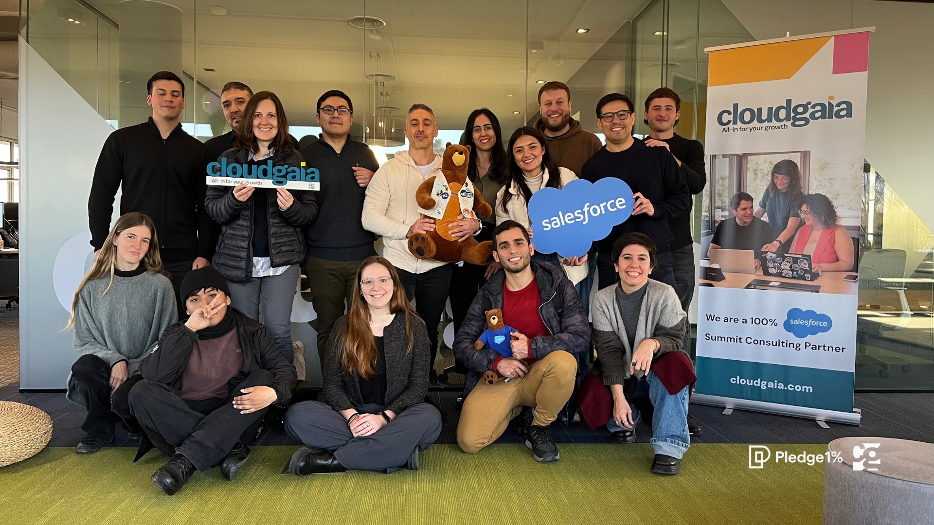 Talento Tech participants and Cloudgaia colleagues gathered in the Buenos Aires office with Salesforce props
