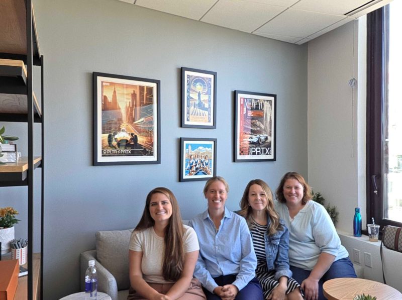 Nicole Sanders and colleagues meeting in an office