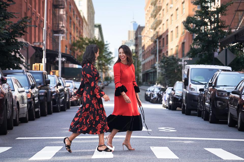 Andrea Oliveri and Nicole Vecchiarelli walking together on a New York street