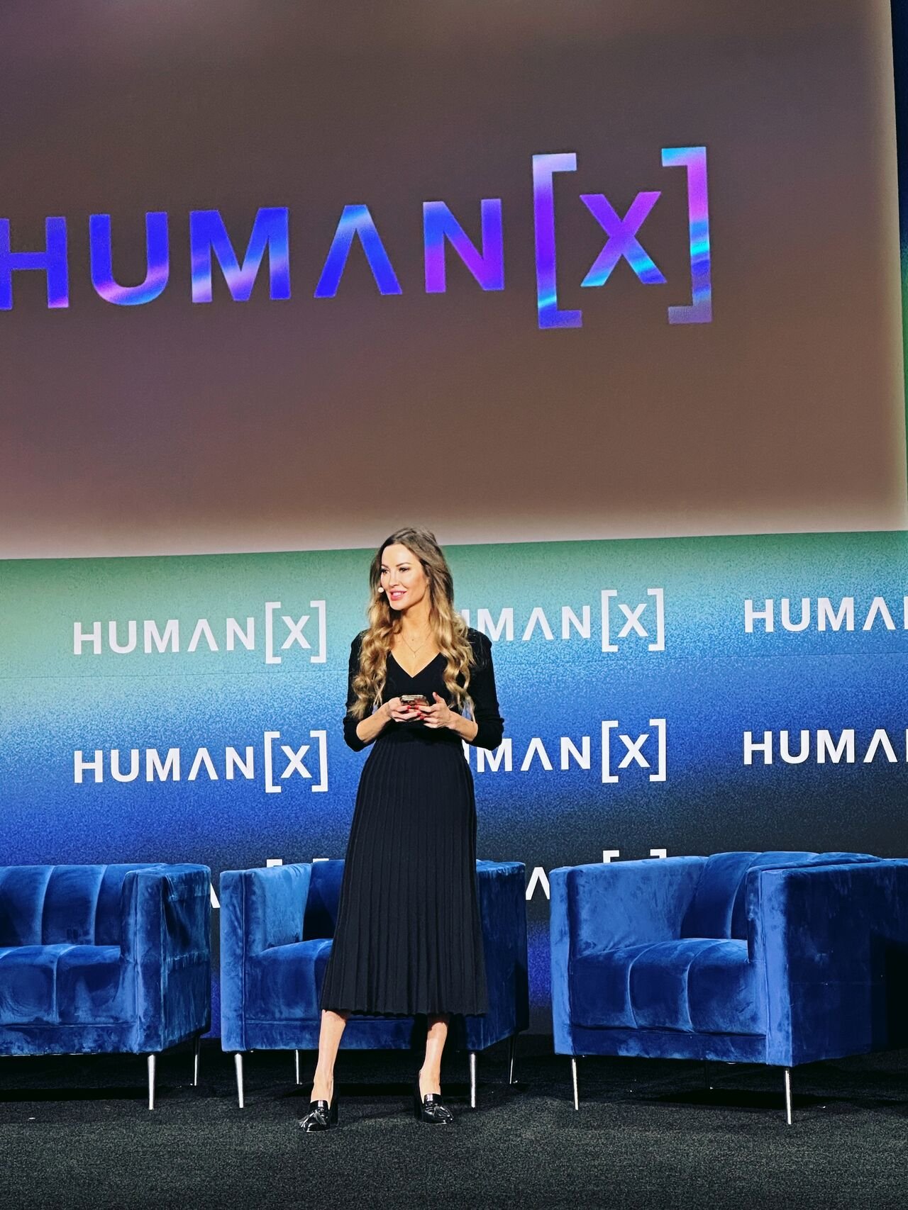 Nicole Zheng speaking onstage at HumanX