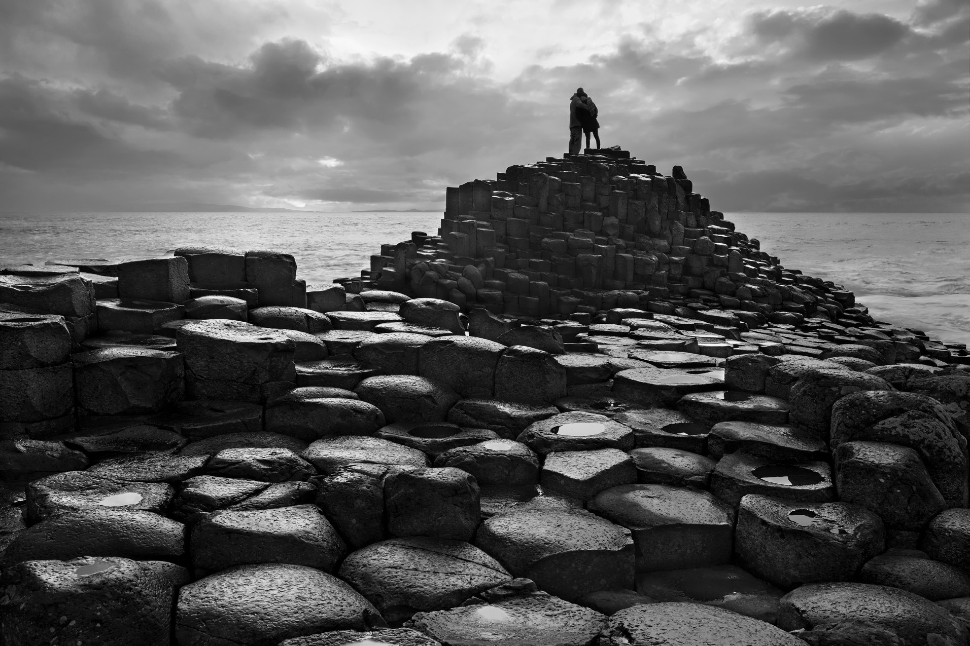 Black and white photograph of the basalt columns at the Giant’s Causeway on the Northern Ireland coast