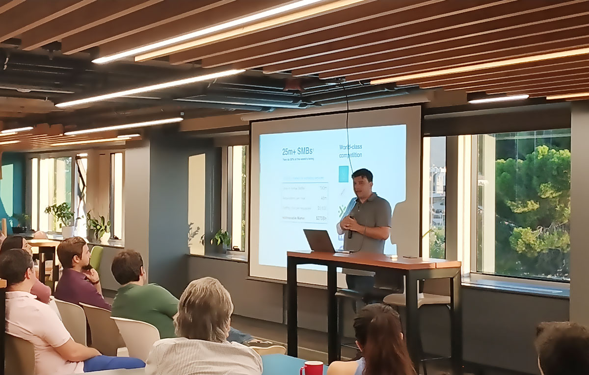 Nikos Moraitakis speaking to a seated audience at Workable during a ScaleUpGreece workshop