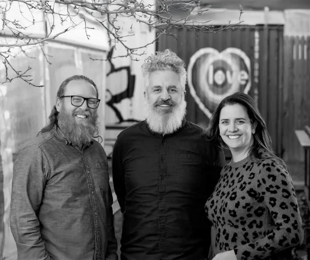 Three members of Nimble Gravity’s leadership group in a black-and-white company photograph