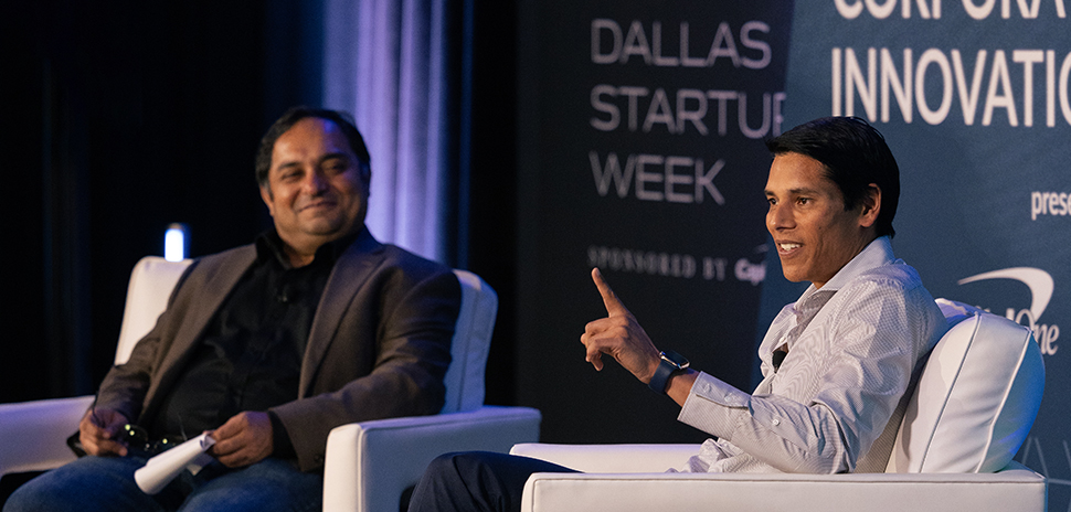 Nirav Tolia, seated at right, speaking on a Dallas Startup Week stage.
