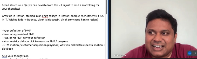 Nishchay AG speaking with Sajith Pai, beside Pai’s interview notes
