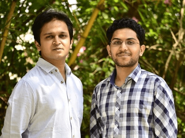 Nishith Rastogi on the left and Locus co-founder Geet Garg on the right, standing outdoors
