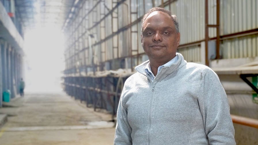 Nitin Gupta standing inside an industrial facility