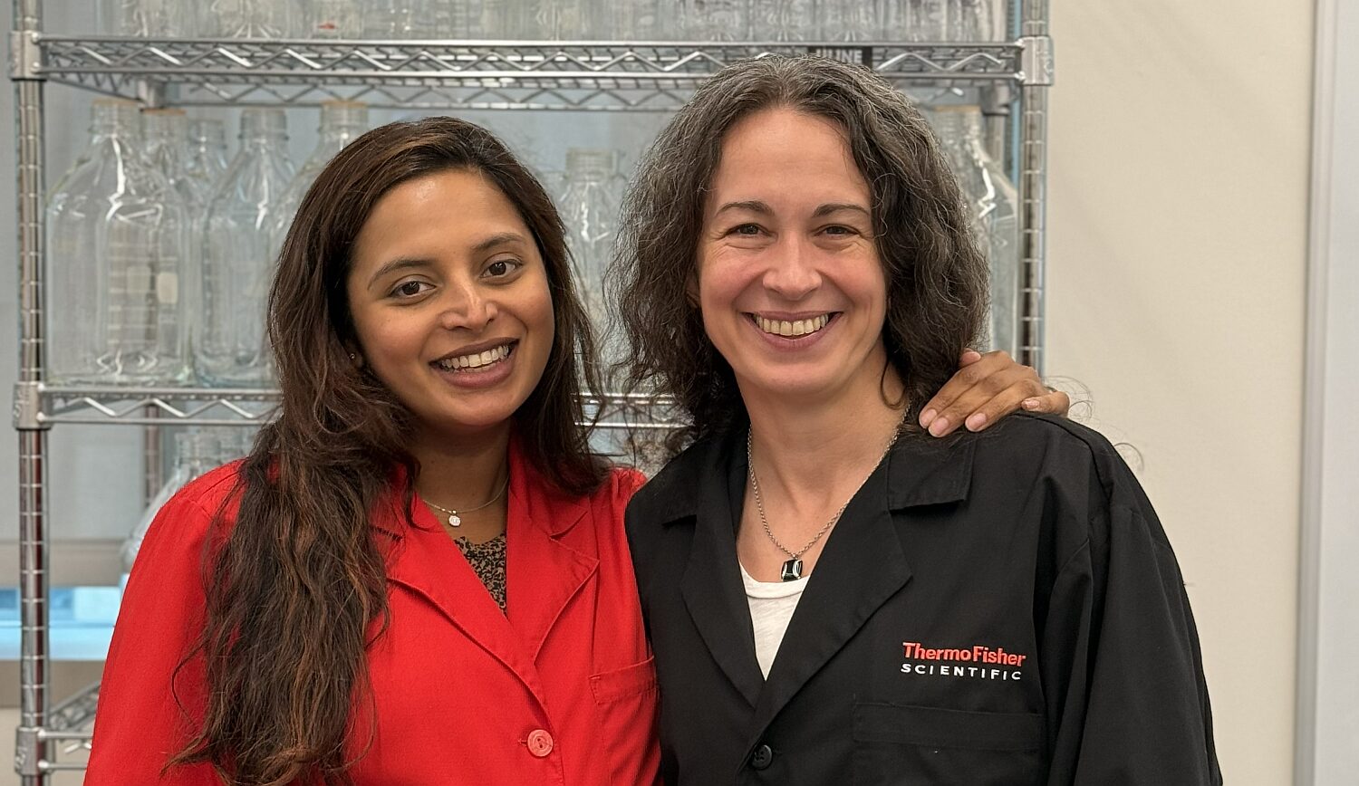 Niya Gupta on the left and Patricia Bubner on the right standing together at a laboratory