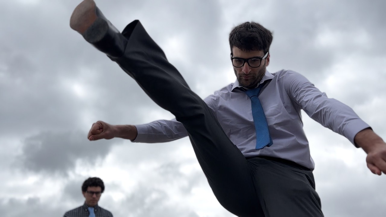 Noah Levy performs a dramatic kick in the Nine Fives launch video