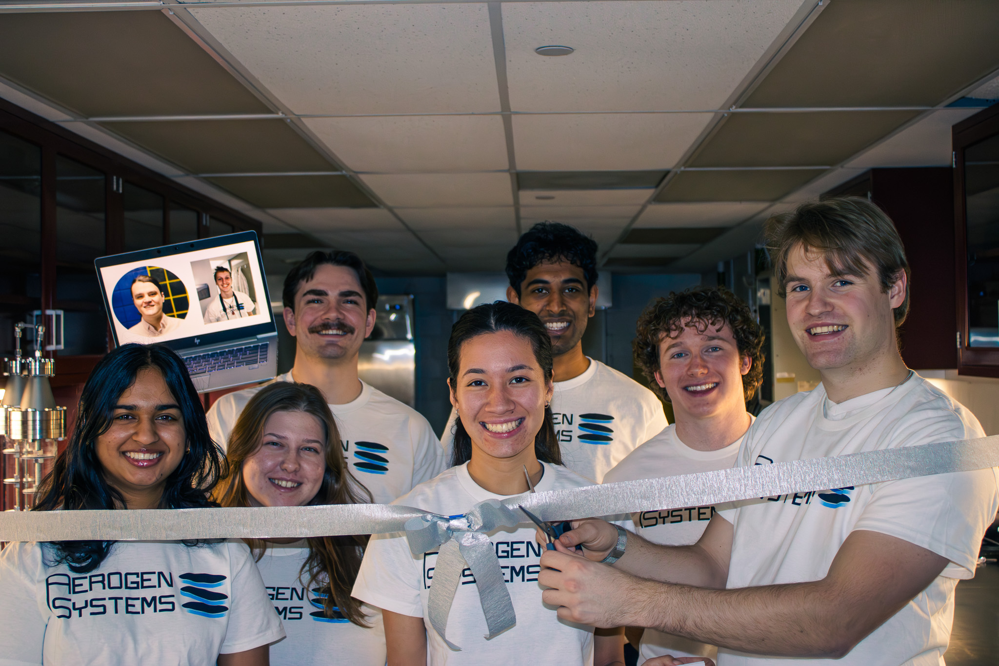 The Aerogen Systems team gathers at a ribbon cutting in its Ann Arbor workspace