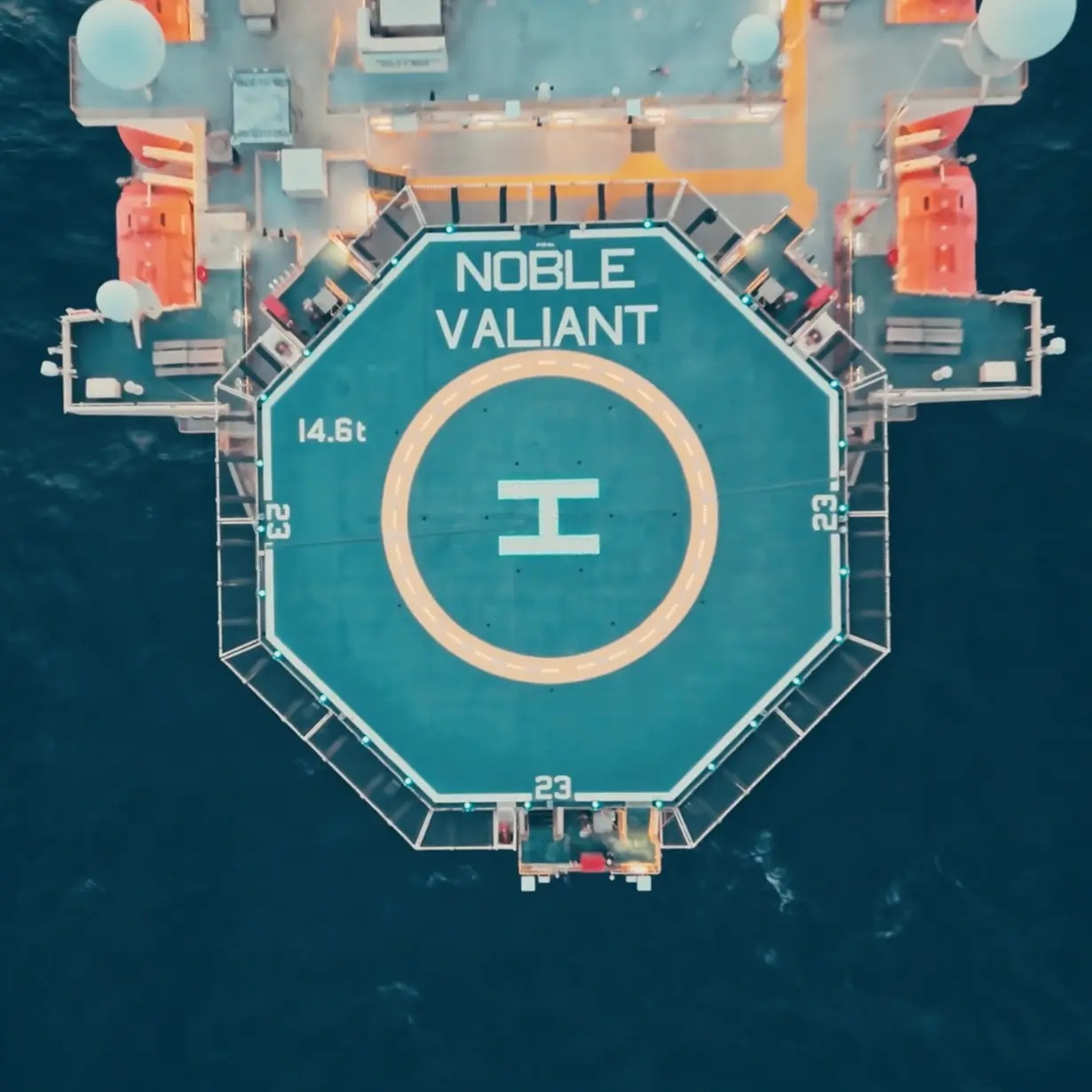 An overhead view of the Noble Valiant helideck surrounded by dark ocean