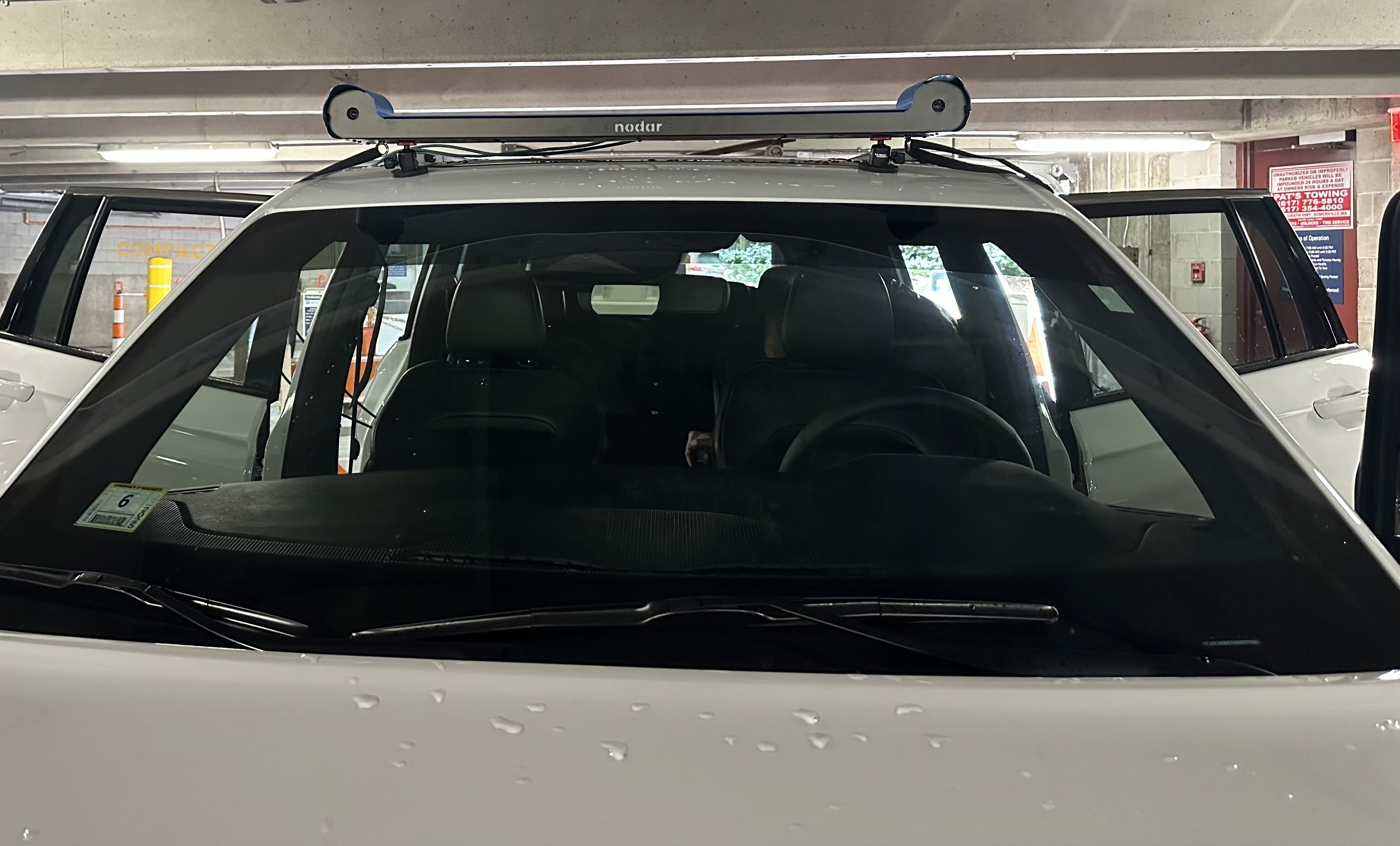 A NODAR Hammerhead camera bar mounted across the roof of a white vehicle