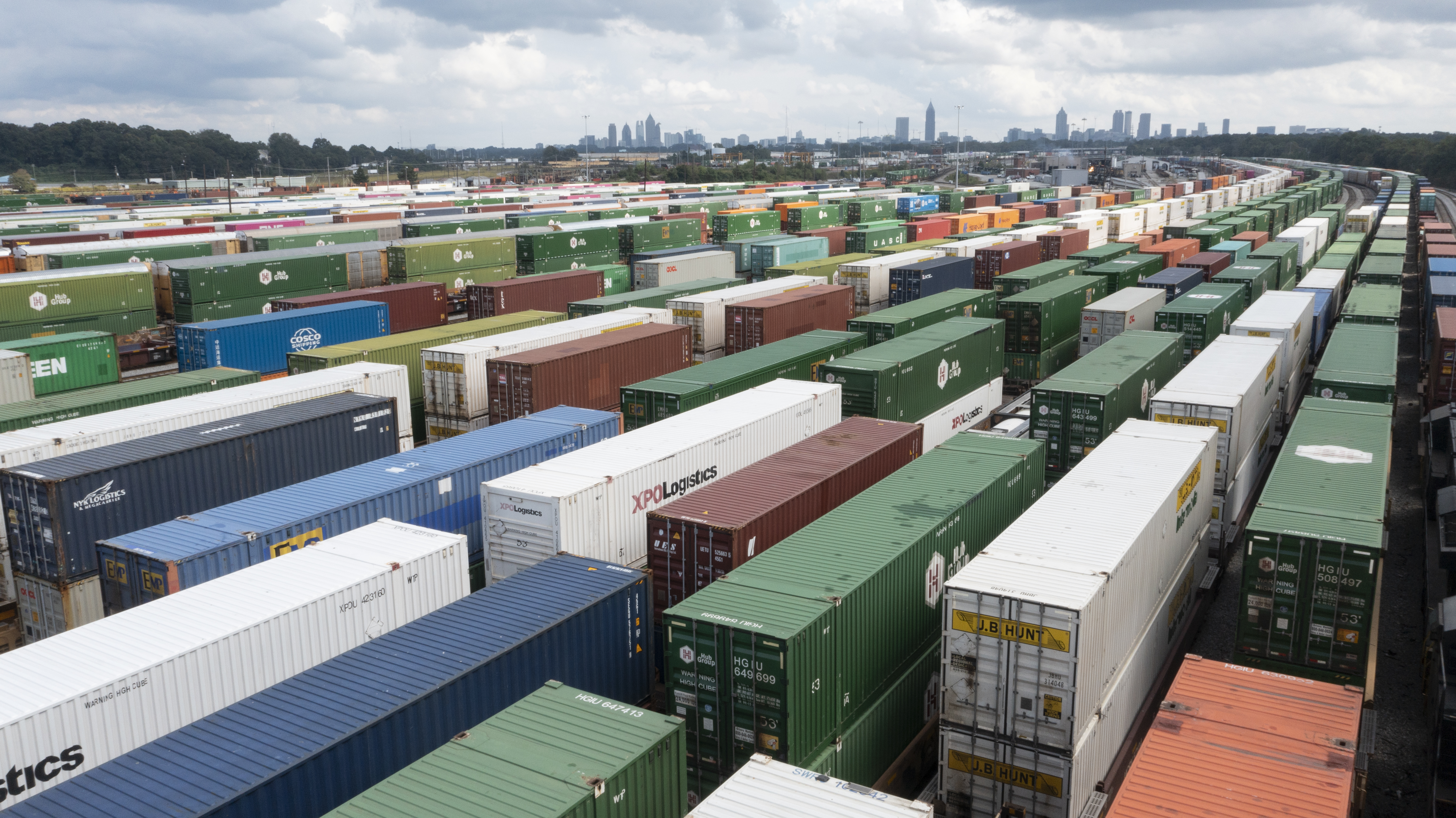 Rows of intermodal containers at Norfolk Southern’s Inman Yard, with Atlanta’s skyline beyond