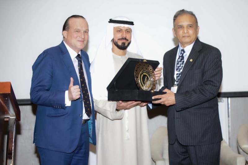 Norman Kutemperor, right, receiving the Most Valuable Big Data Technology Platform 2021 award with two presenters