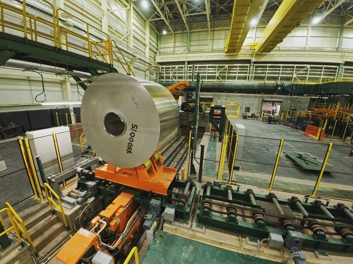 The first aluminum coil on equipment inside Novelis’s Bay Minette cold mill