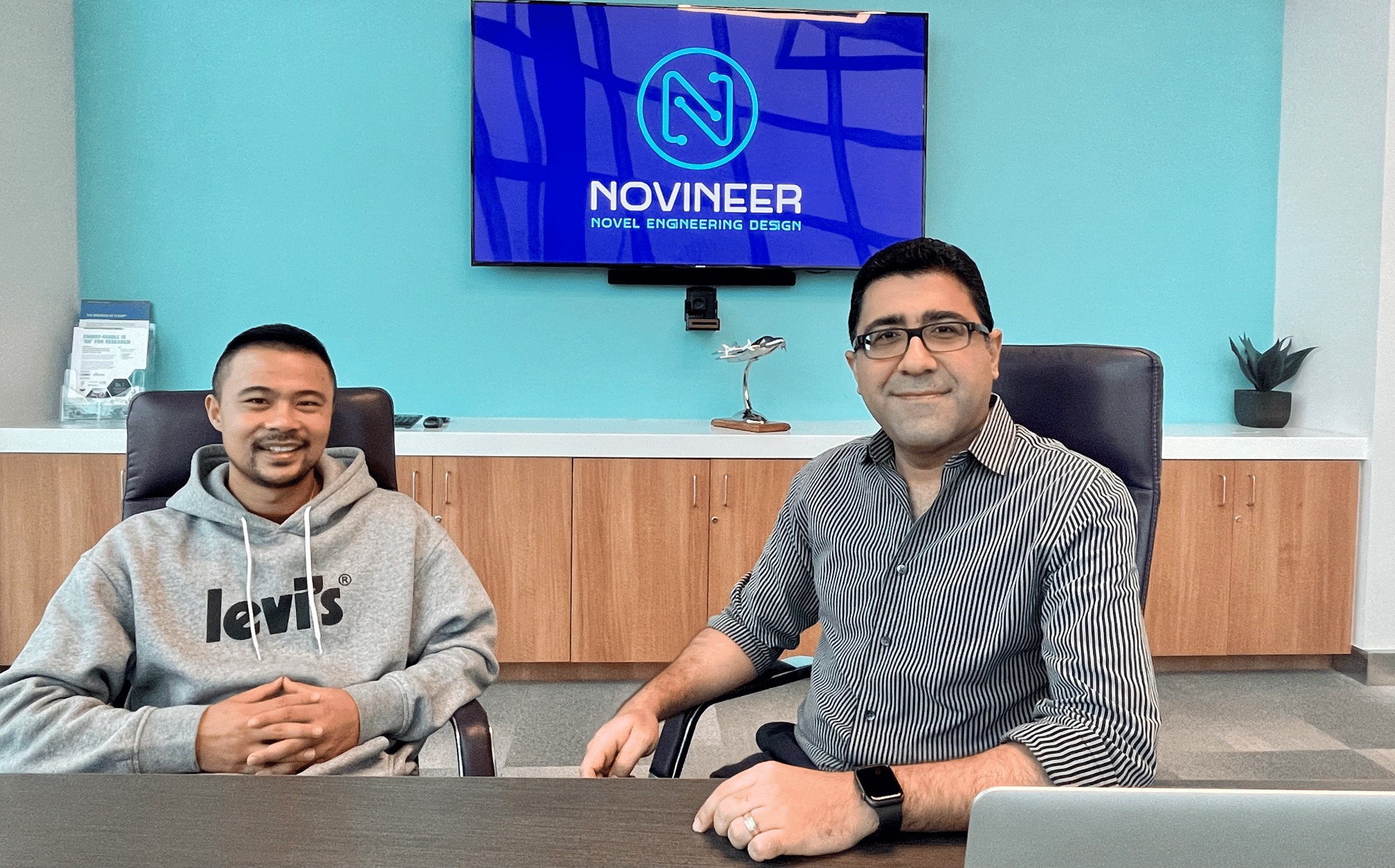 Novineer co-founders Zhichao Wang and Ali Tamijani seated in their office