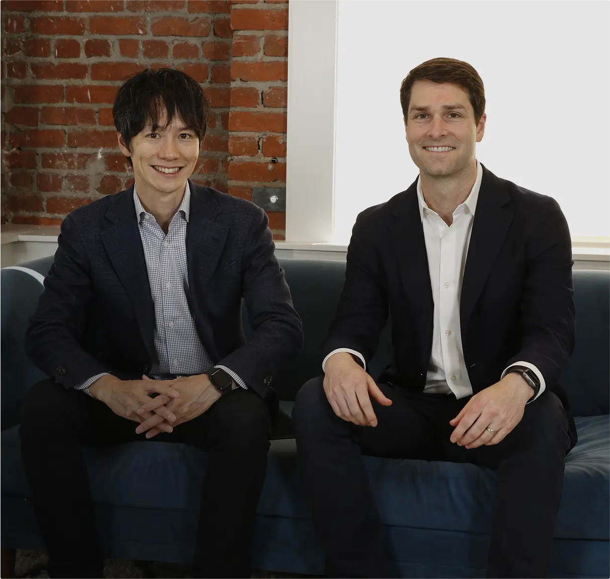 Nozomu Tsunoda, left, and Daniel Lewis seated together