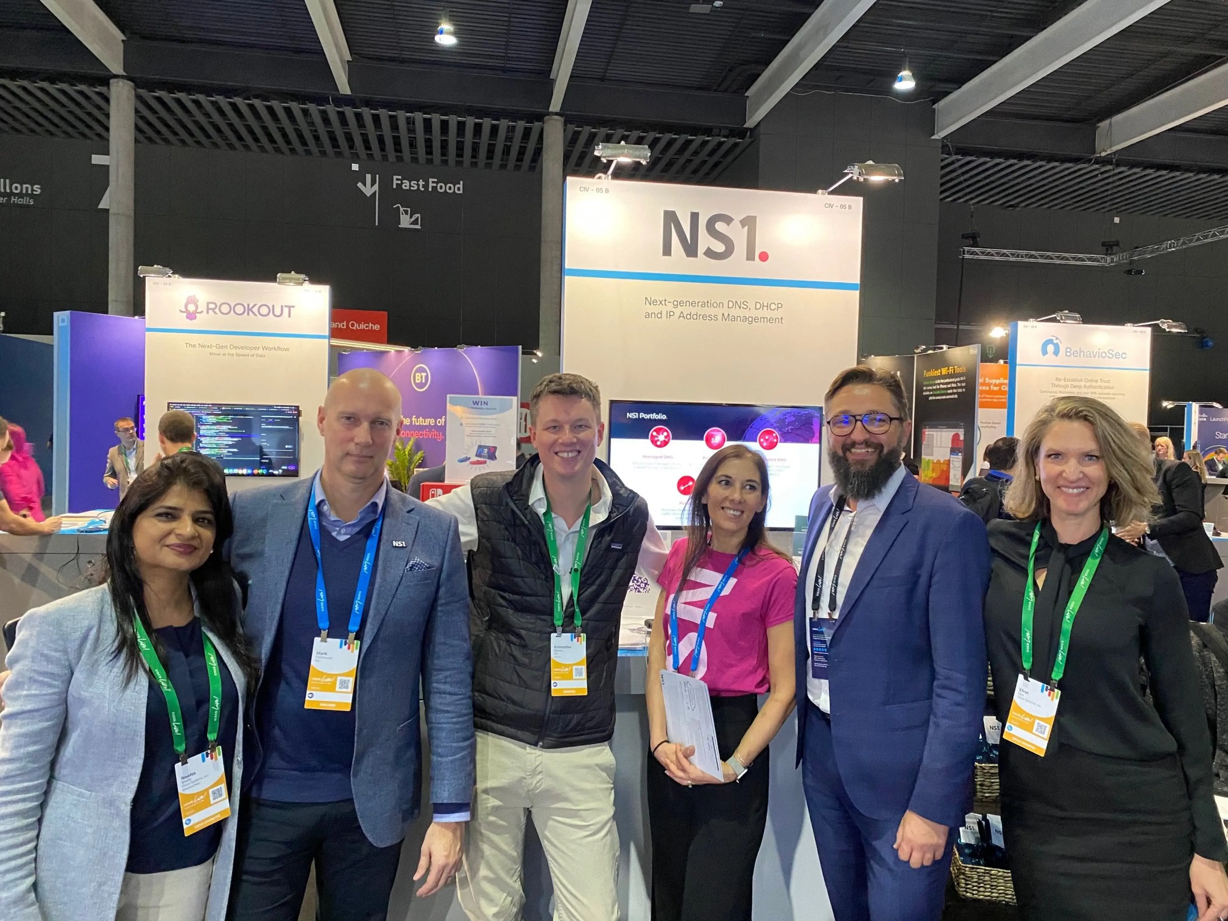 People gathered at an NS1 exhibition stand in a photograph published by Cisco Investments