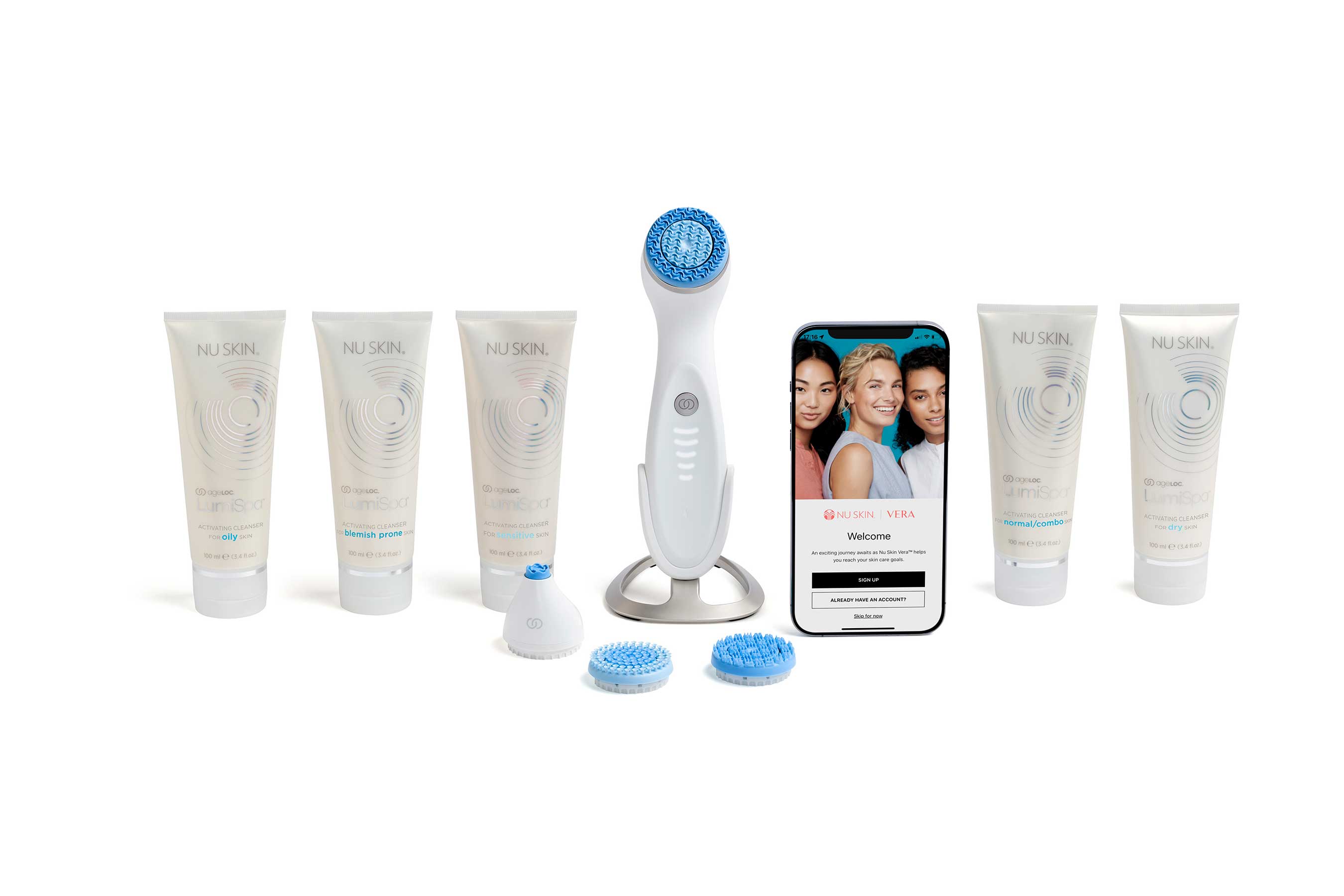 LumiSpa iO cleansing device surrounded by five cleansers, treatment heads and the Vera app on a phone