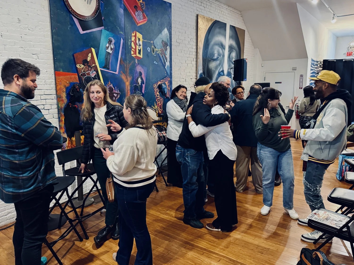 People talking together at a Secret Society of Black Creatives gathering in Boston
