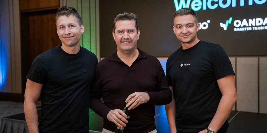 FTMO founders Otakar Šuffner and Marek Vašíček with then OANDA CEO Gavin Bambury at the acquisition celebration